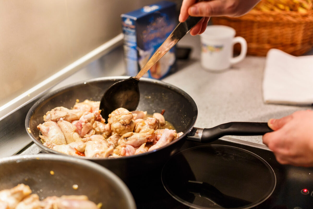 10 Ways You Are Cooking Meat Wrong and How to Fix Them 2 pan with chicken wings on the stove