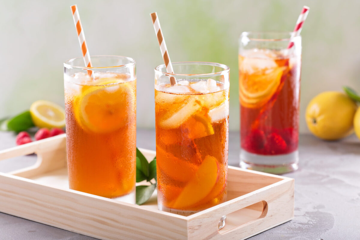7 Sugary Drinks That Are Sabotaging Your Health 3 Iced tea variety in tall glasses on green background