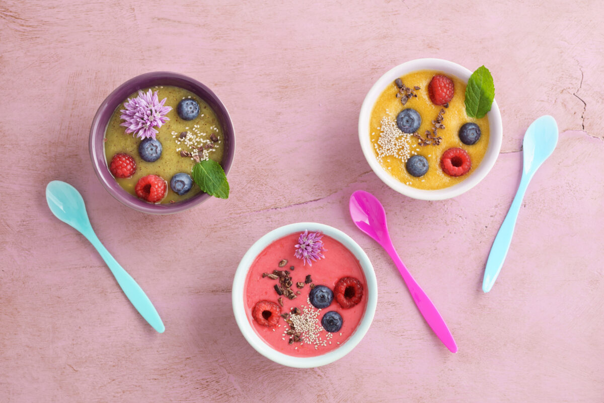 How These 6 “Age Defying” Foods Could Be Harming Your Skin 1 Three smoothie bowls with blueberries, raspberries, kiwi and peach