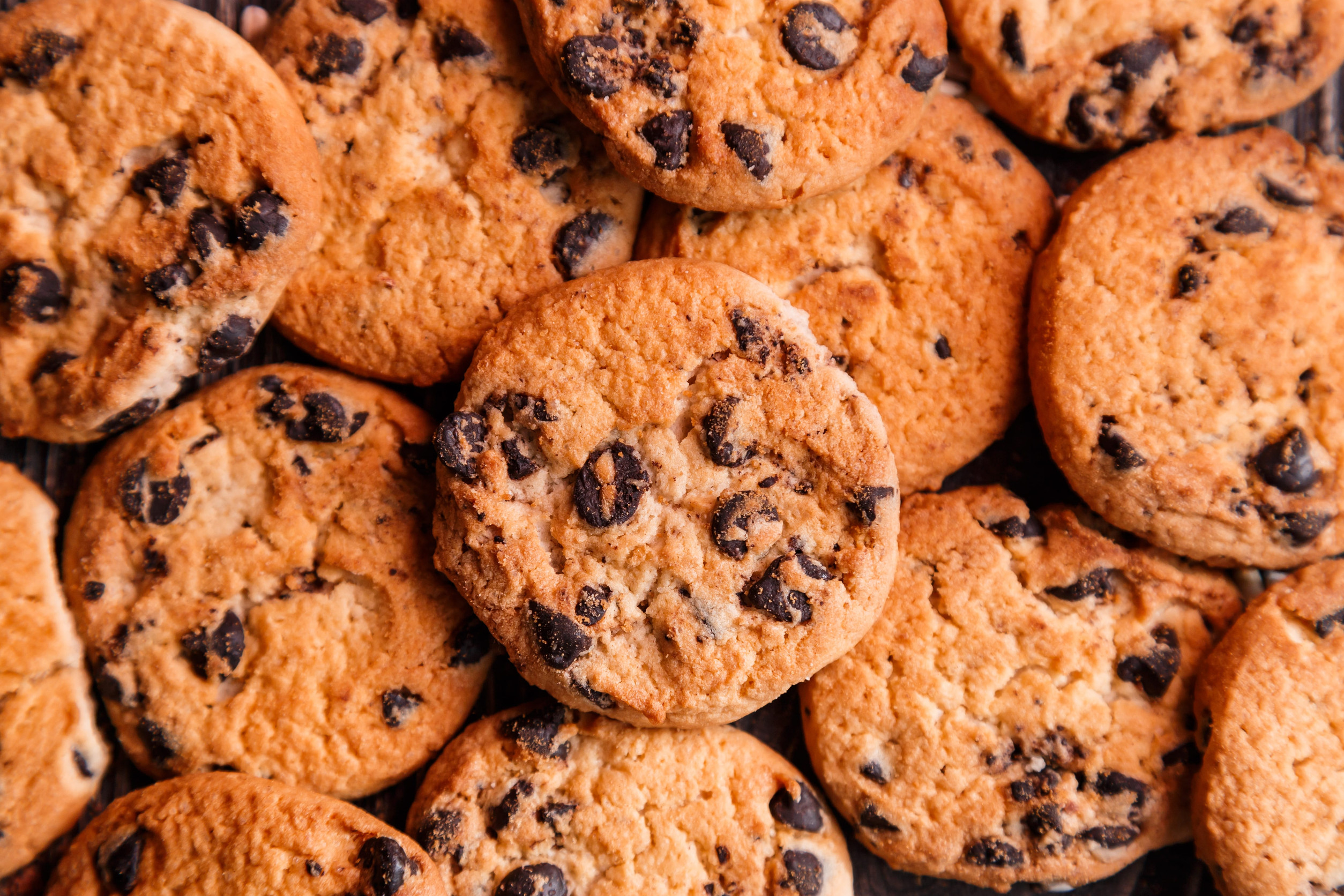 Lots of delicious homemade chocolate chip cookies. View from above