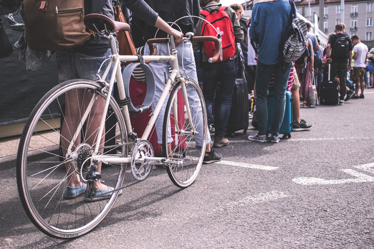10 Ways People Got Paid to Do Nothing 1 A diverse group of adults lined up in a city street, showcasing urban life.