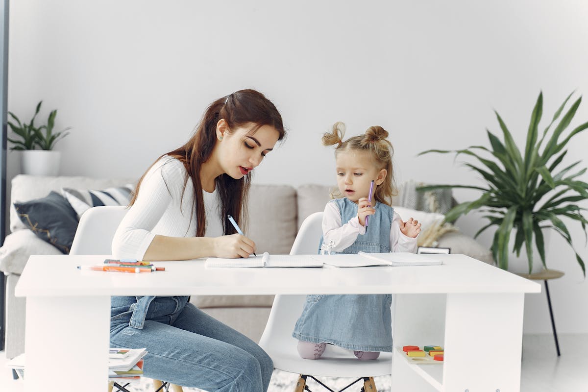 8 Time-Draining Things That Will Exhaust You As A Parent 1 A mother and daughter enjoying a bonding moment while doing homework together at home.