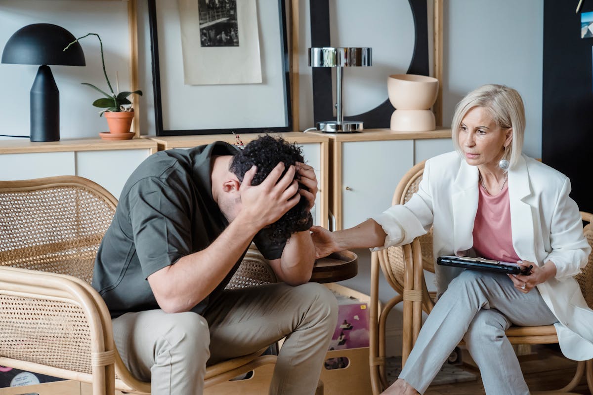 Divorced Women Expose the 8 Mistakes That Destroyed Their Marriages 4 A supportive therapist provides comfort during a counseling session in a cozy office.