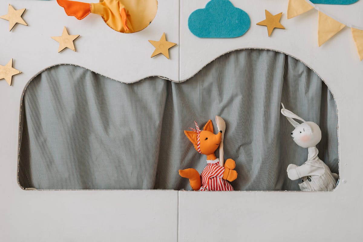 10 Kids' TV Characters That Gave Us Nightmares, And Why They Still Haunt Us 2 A whimsical puppet show featuring colorful fabric puppets on a playful stage.