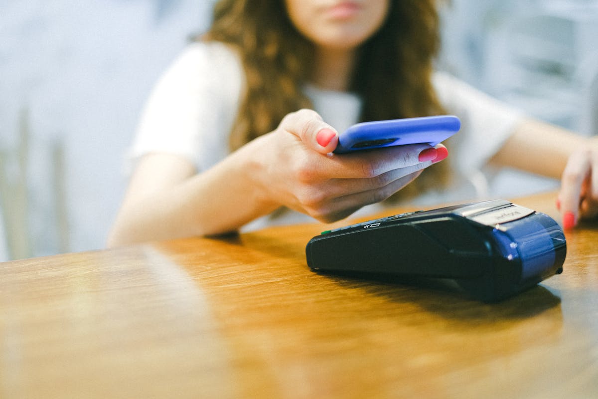 10 Everyday Items That Didn’t Exist 15 Years Ago But Now Define Modern Life 2 A woman processes a contactless payment using her smartphone at a payment terminal.