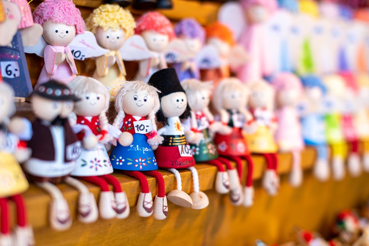 9 Strangest Celebrity Collections 1 Charming hand-painted dolls displayed in a Zakopane gift shop, showcasing local Polish craftsmanship.