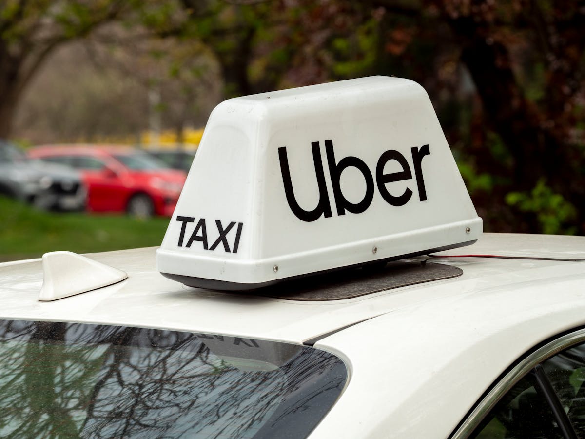 10 Everyday Items That Didn’t Exist 15 Years Ago But Now Define Modern Life 4 Close-up of a white Uber taxi sign on a car roof in Wrocław, Poland.