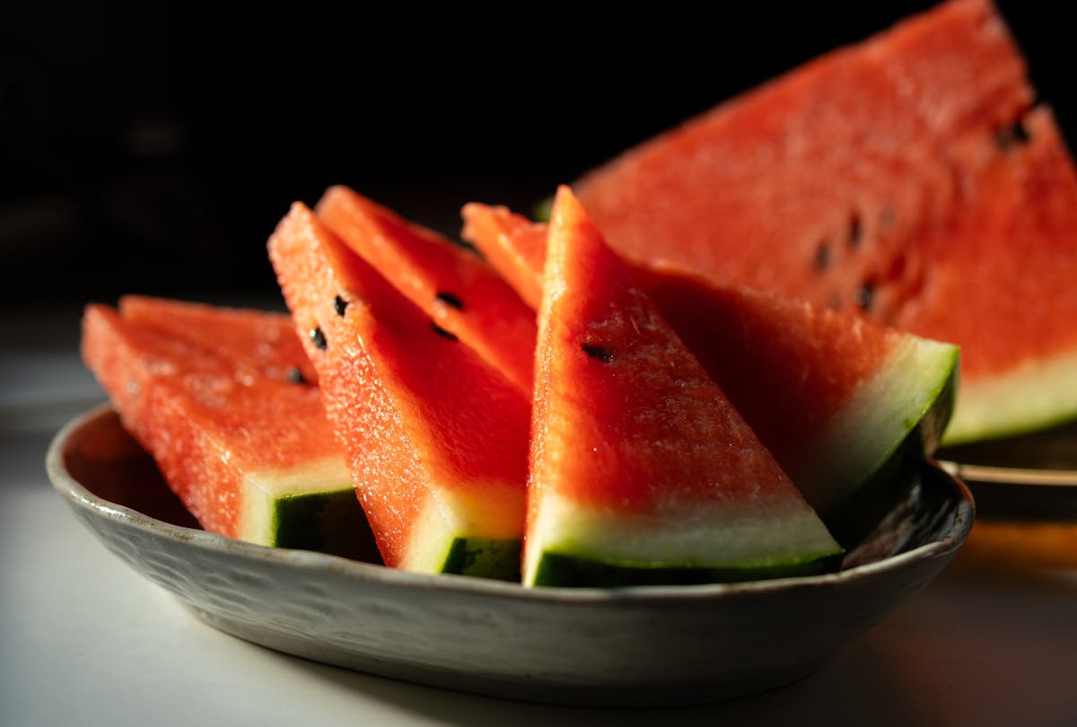 10 Foods You’re Not Eating That Could Be Secretly Causing Dehydration 1 Close-up of juicy watermelon slices beautifully arranged in a ceramic bowl, perfect for summer refreshment.