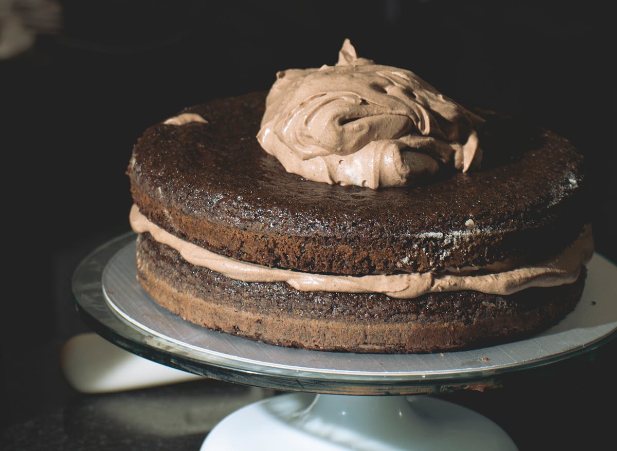 10 Unexpectedly Delicious Recipes With Surprising Ingredients 5 Decadent chocolate layer cake with rich frosting on display. Ideal for dessert lovers.