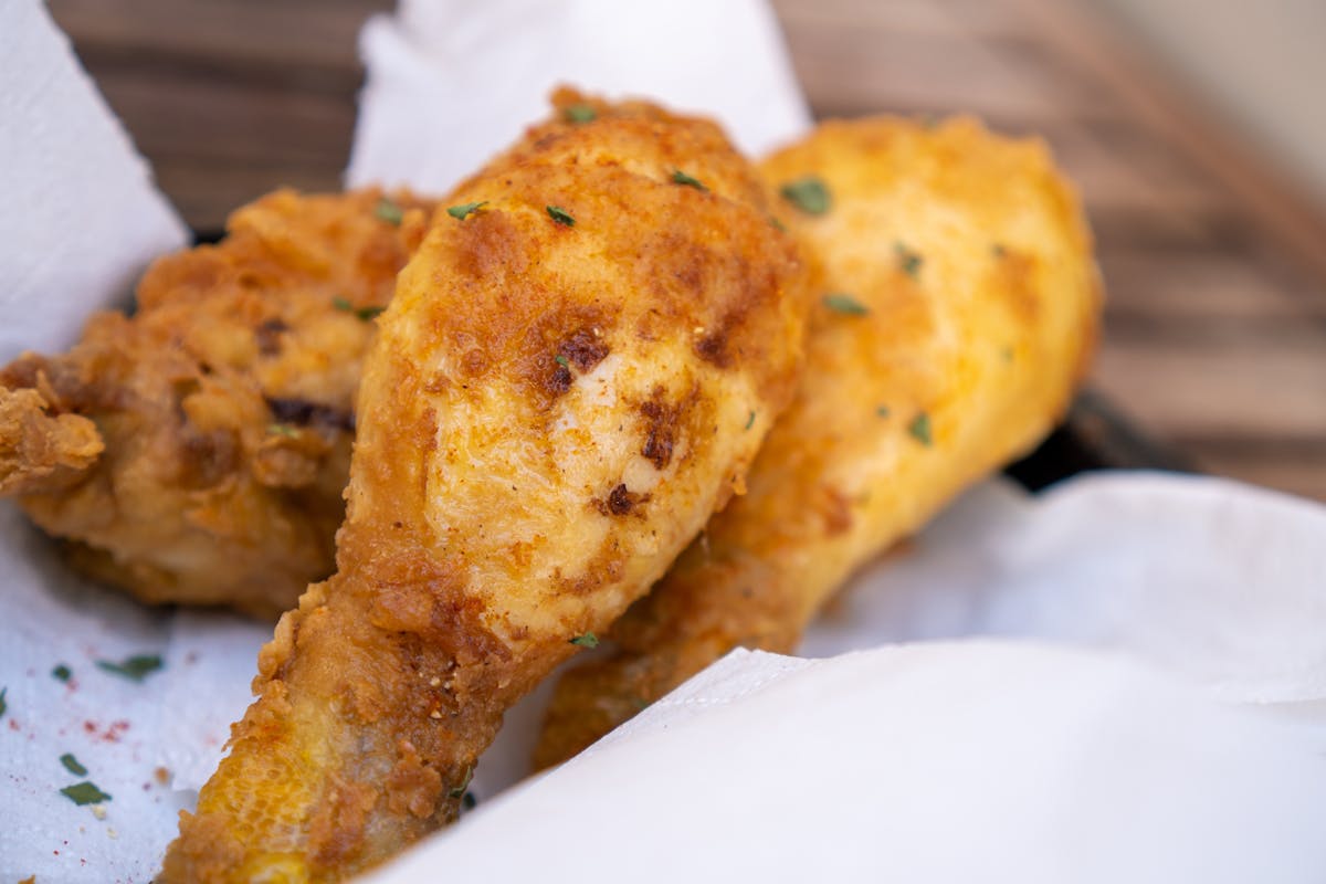 12 Unhealthy Foods to Avoid for Better Health 2 Delicious golden brown fried chicken drumsticks, perfectly crispy and appetizing.