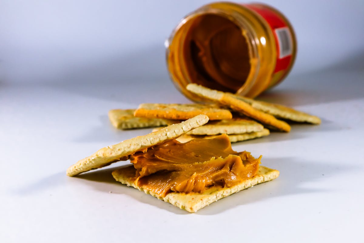 10 American Foods That Seem Bizarre To The Rest of the World 1 Delicious peanut butter spread on crispy crackers, perfect for a tasty snack.