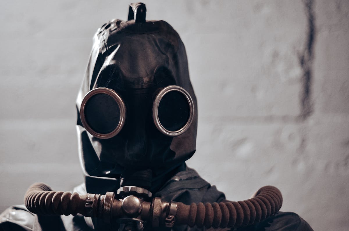 10 Kids' TV Characters That Gave Us Nightmares, And Why They Still Haunt Us 3 Dramatic portrait of an individual wearing a gas mask, evokes themes of protection and secrecy.