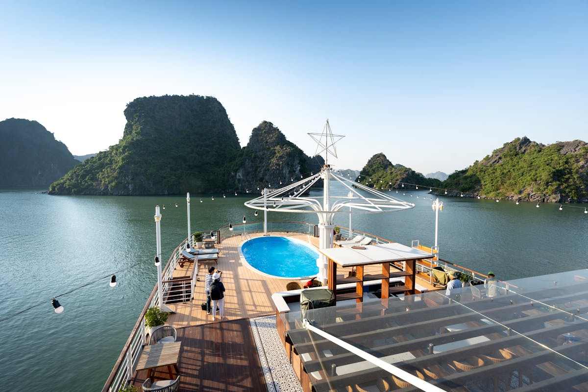 6 Weird Things on Cruise Ships Most Passengers Never Expect to Find 3 Experience luxury cruising with a scenic view of limestone karsts and onboard pool amenities.