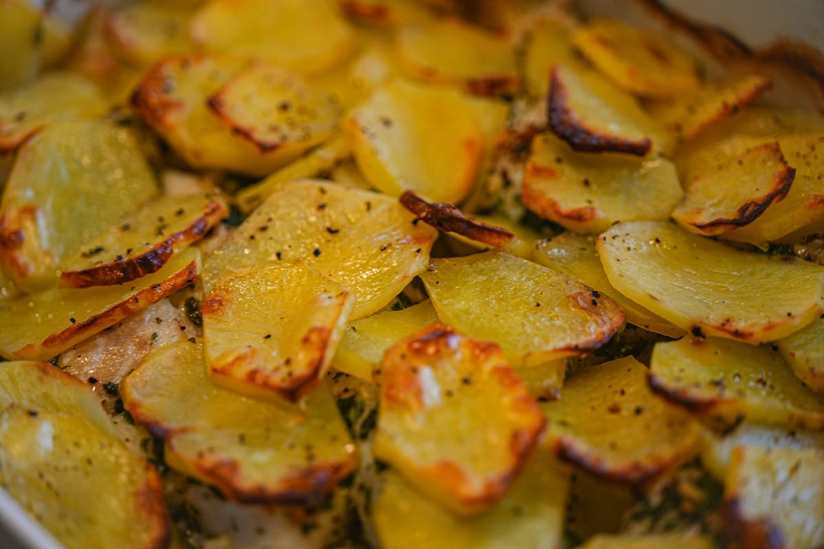10 Unexpectedly Delicious Recipes With Surprising Ingredients 4 Golden roasted potato slices seasoned with herbs and pepper, cooked to crispy perfection.