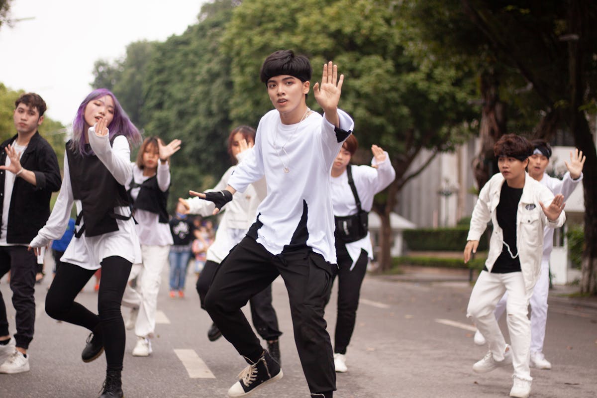 10 Wild Things That Happened in 2010 That Still Feel Unreal Today 4 Group of young adults performing an energetic street dance routine outdoors.