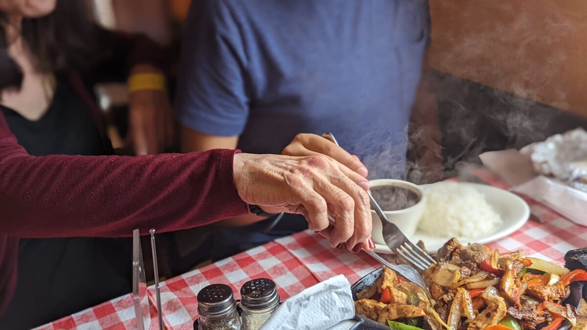 8 Outdated Boomer Eating Habits That Are Hurting Your Health and Need to End 4 enjoying-a-hearty-dinner-at-local-restaurant-
