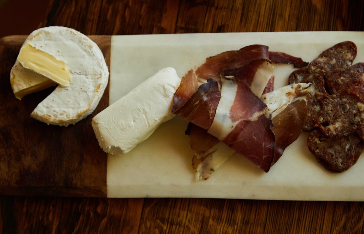 6 Pioneer Foods That Make the Wild West Look Far Less Glamorous 3 slices-of-ham-and-cheese-on-a-charcuterie-board-