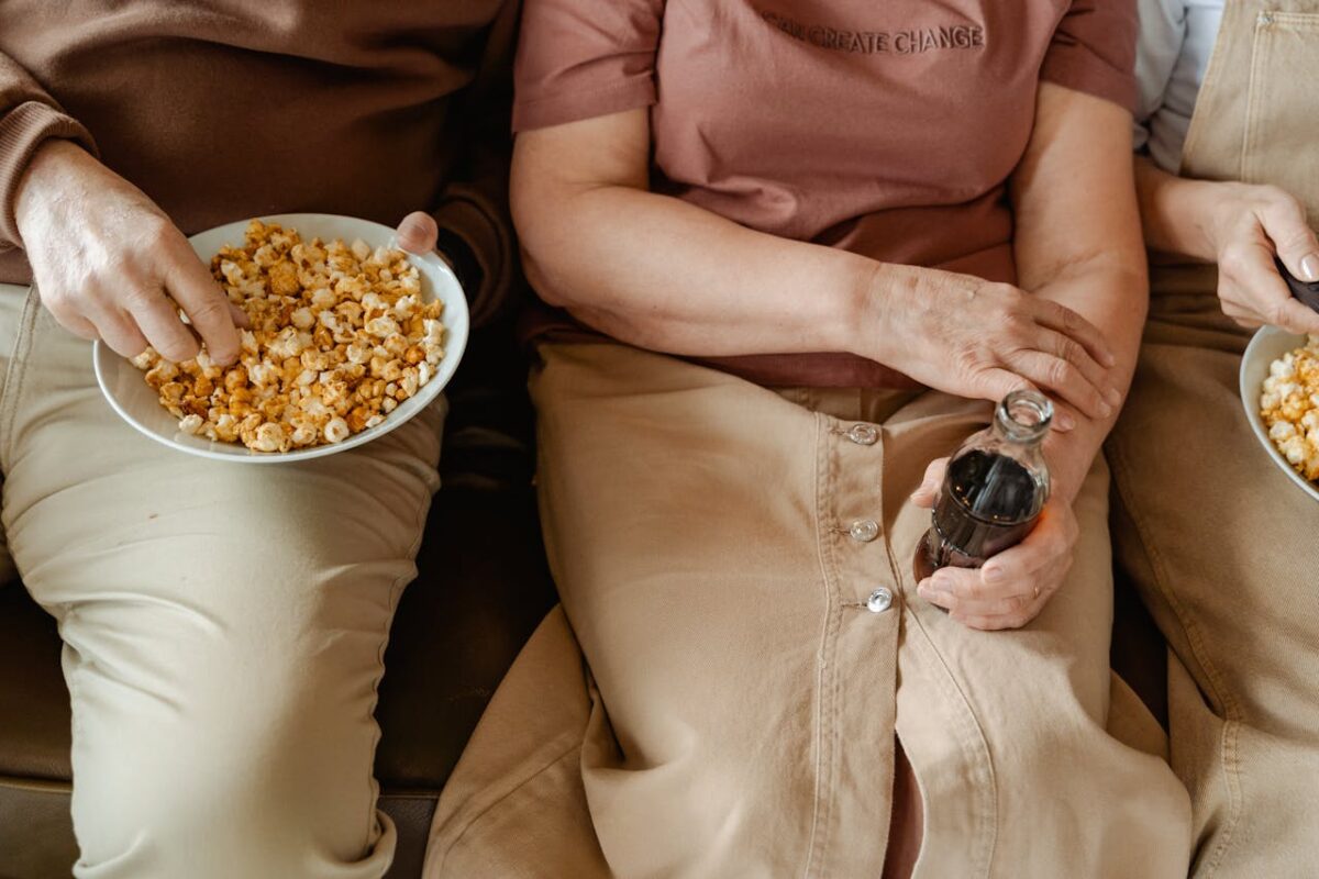 8 Outdated Boomer Eating Habits That Are Hurting Your Health and Need to End 2 person-holding-a-bowl-with-popcorn-