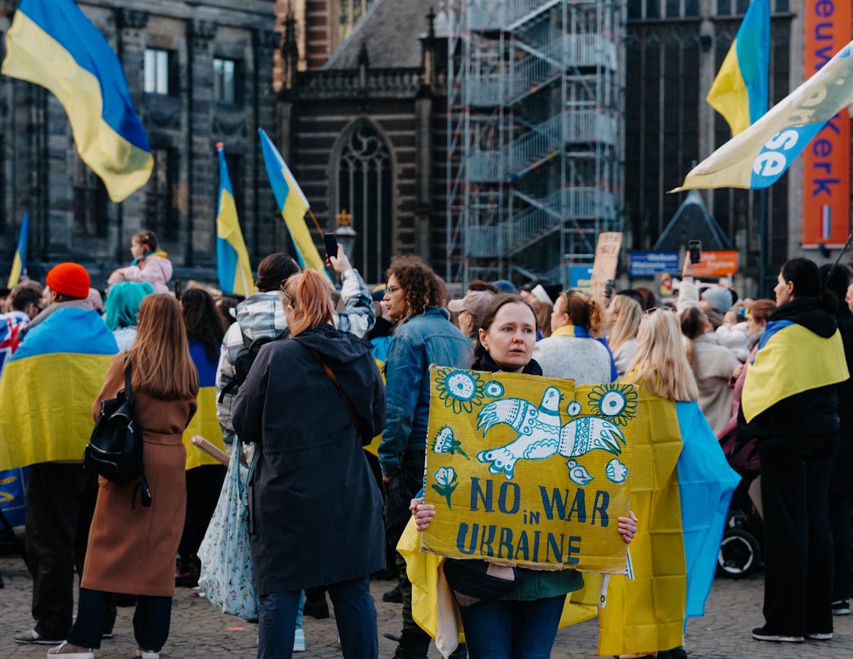 10 Political Scandals That Shook Nations and Triggered Mass Uprisings 3 Protest in Amsterdam against war in Ukraine, showcasing solidarity and peace activism.