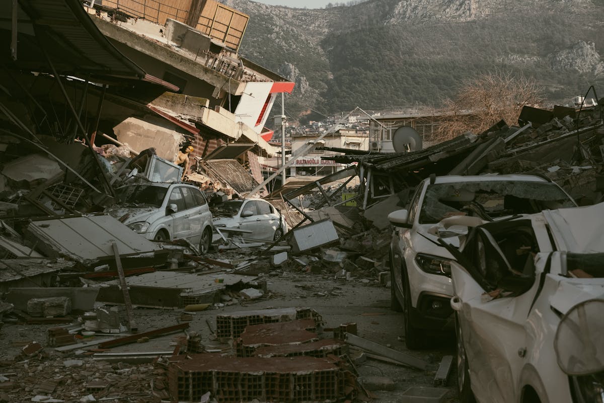 7.3 Mexico Earthquake Shakes 3 Countries as 300-Kilometer Tsunami Threat Sparks Alarm 2 Severe earthquake damage in Antakya, Türkiye, with collapsed buildings and cars.