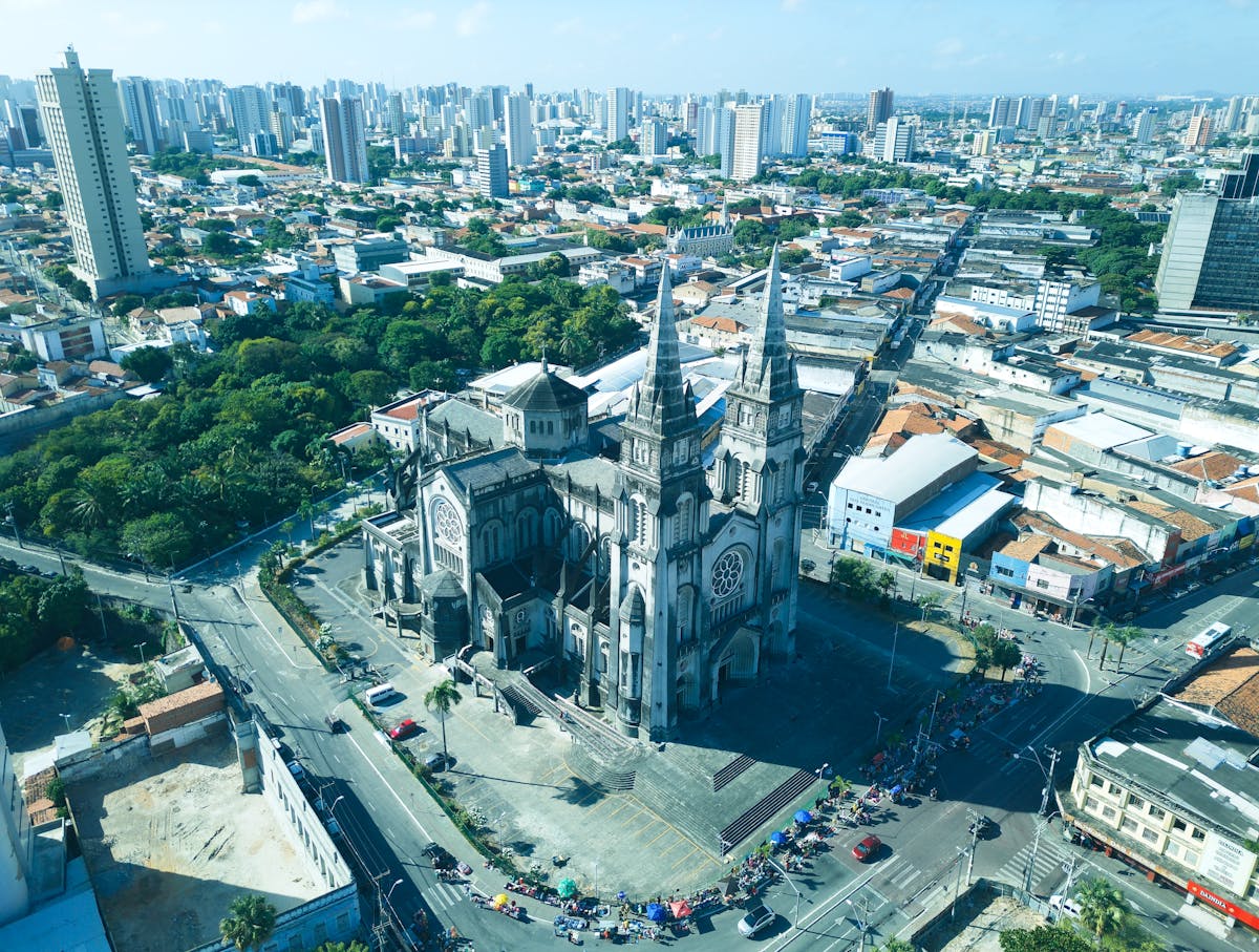 10 Most Dangerous Cities in the World to Avoid in 2026 3 Stunning aerial view of the Metropolitan Cathedral amidst Fortaleza cityscape, Brazil.