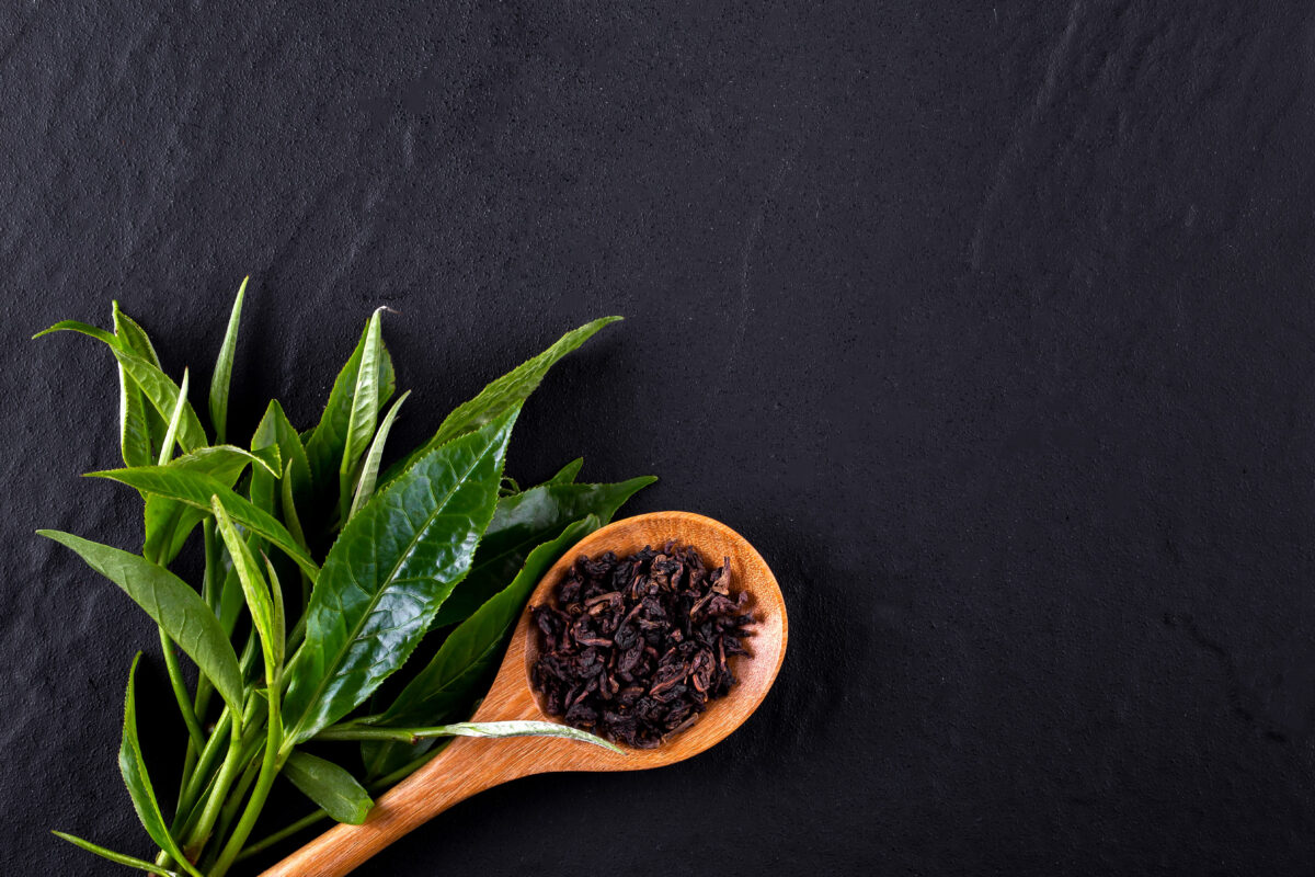 10 Kitchen Staples with Alleged Occult Abilities 6 Top view of green tea matcha in a bowl on wooden surface