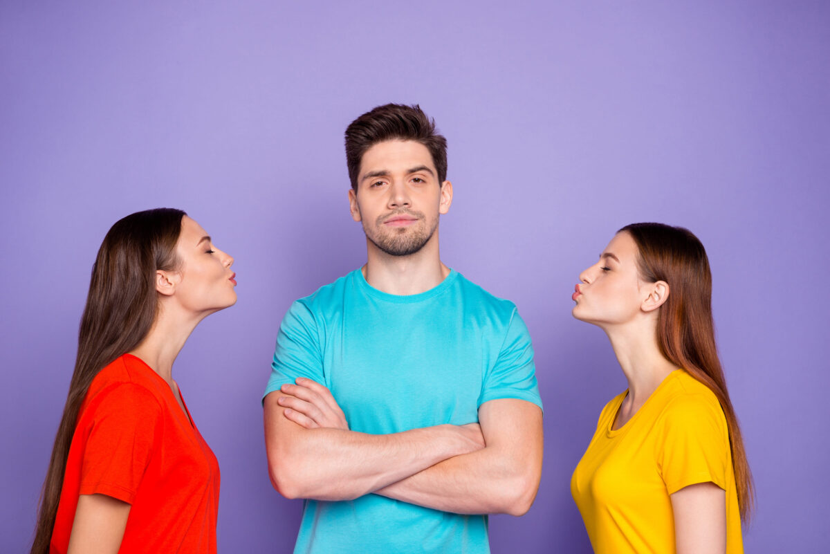 10 Signs Your Relationship Might Be a Rebound And How to Tell 2 Photo of proud self-confident modern hipster in blue outfit choosing the lady to kiss standing with folded crossed arms isolated violet purple background
