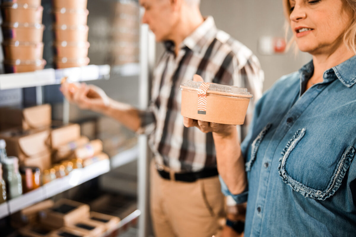 Mature man and woman shopping at the supermarket together
