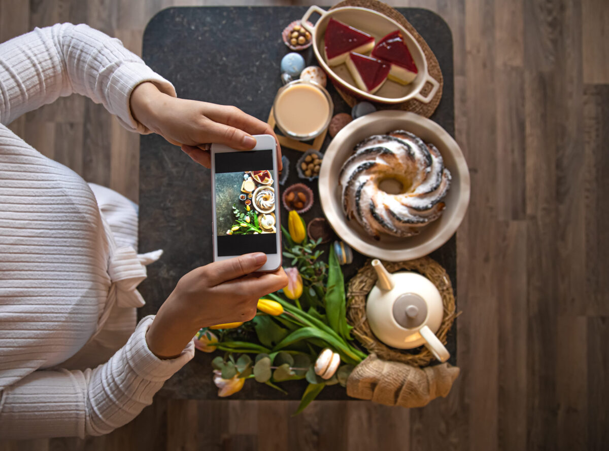 Easter holiday. Photo from your phone, beautifully preserved table, for a festive Easter lunch or Breakfast . The concept of family values and the Easter holiday. top view