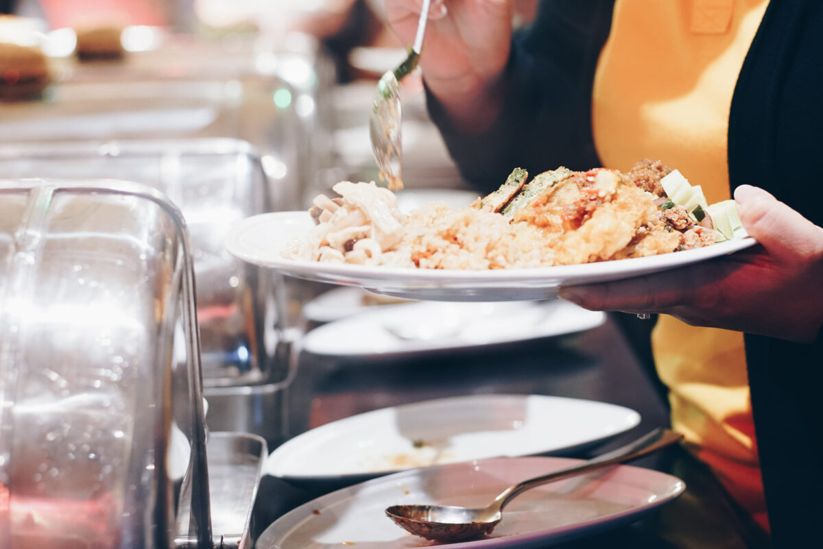Crowd of people enjoying buffet food meal dining Food Options Eating Concept in hotel buffet