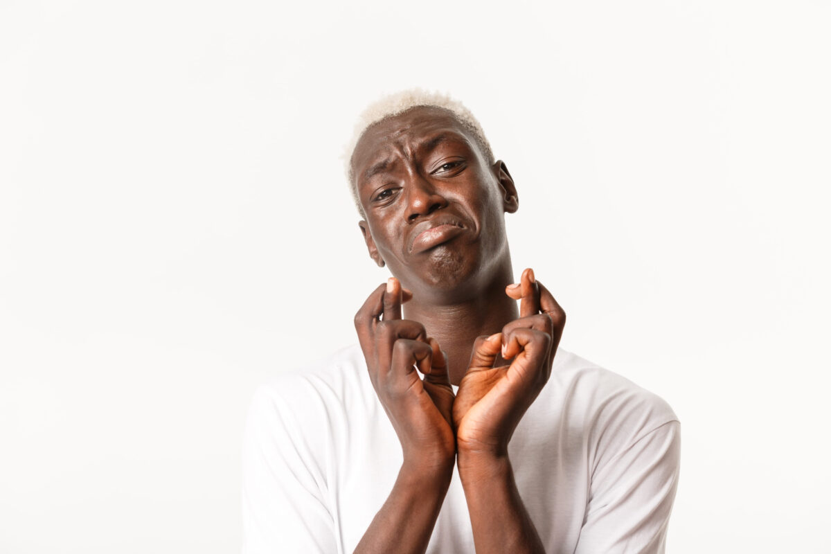 8 Most Painful Medical Conditions Doctors Say You’ll Never Forget 4 Close-up of miserable whining african-american blond guy, pleading or begging, making wish, cross fingers good luck and praying with desperate look, white background