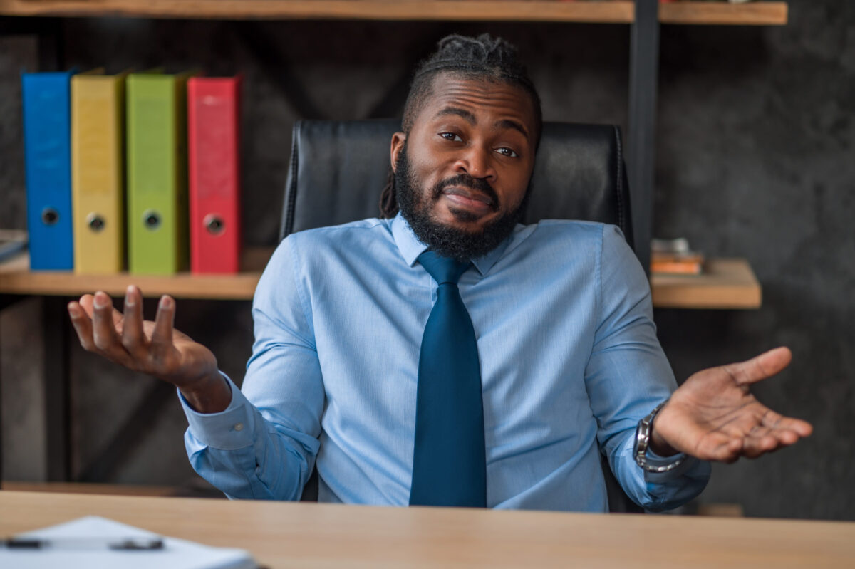 Businessman throwing up his hands in front of someone