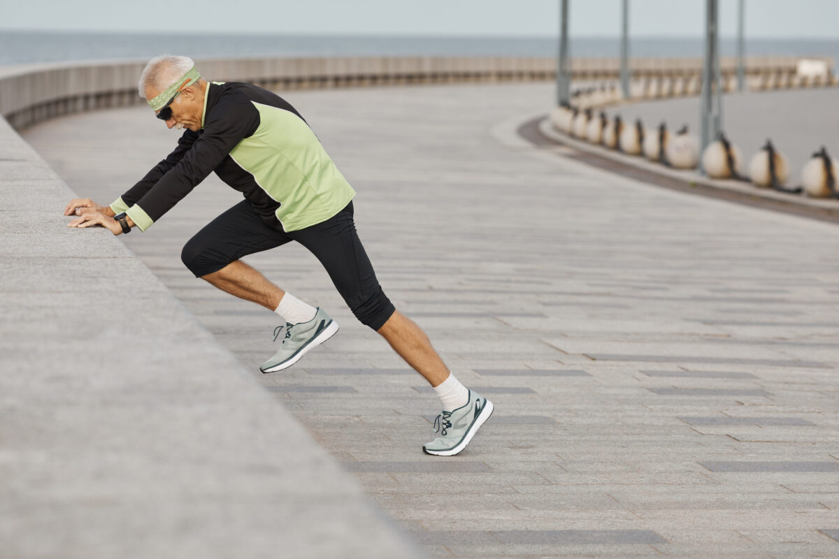 10 Health Mistakes After Age 50 That Can Catch Up Faster Than You Think 1 Horizontal side view shot of sporty senior man doing morning aerobic exercises outdoors