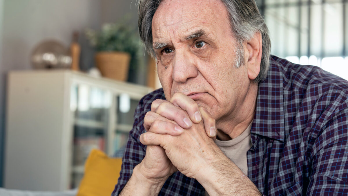 Warning Signs You’re Overly Frugal in Your Golden Years 1 Thoughtful elderly man sitting alone at home
