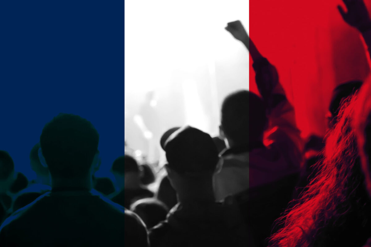 8 High-Tax Countries That Make Ordinary Life Brutally Expensive 2 Protests France Paris. France flag. Protest in France. Rise hand. Pension reforms. Retirement age. Bastille day. Out of focus.