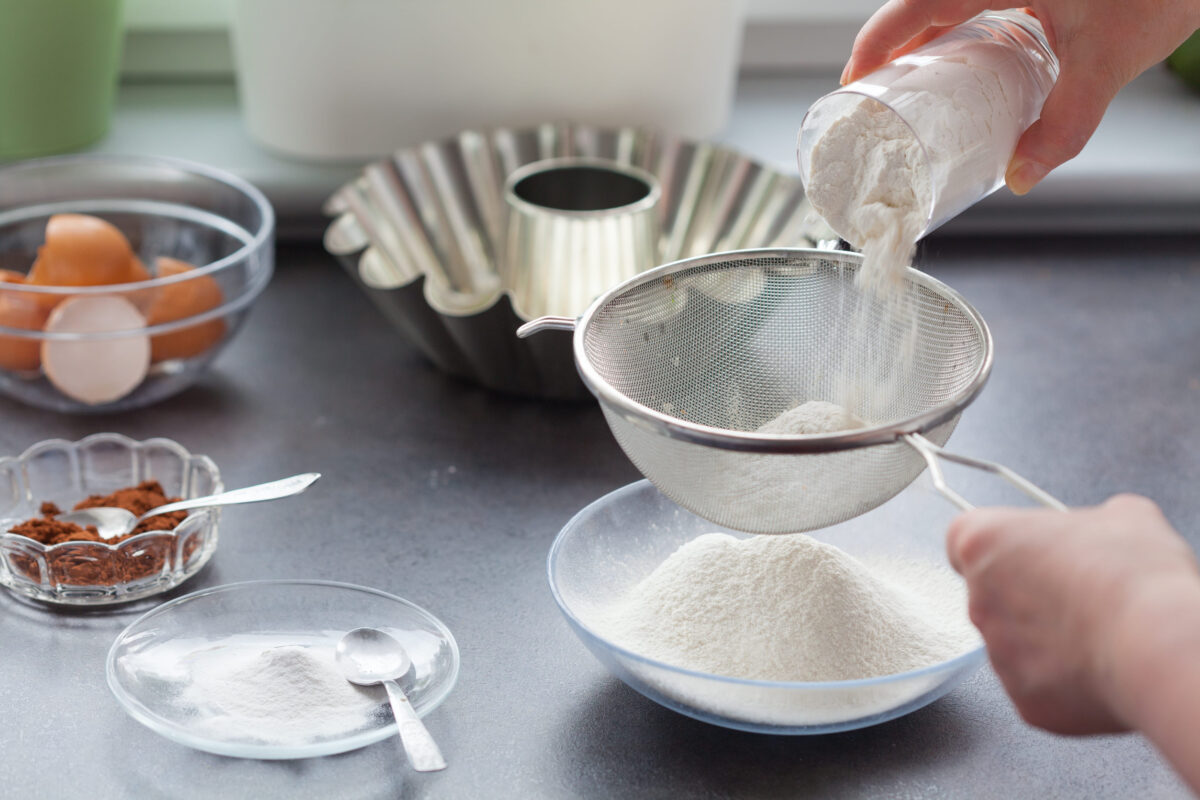 Baking cake. Next stage, sift the flour.
