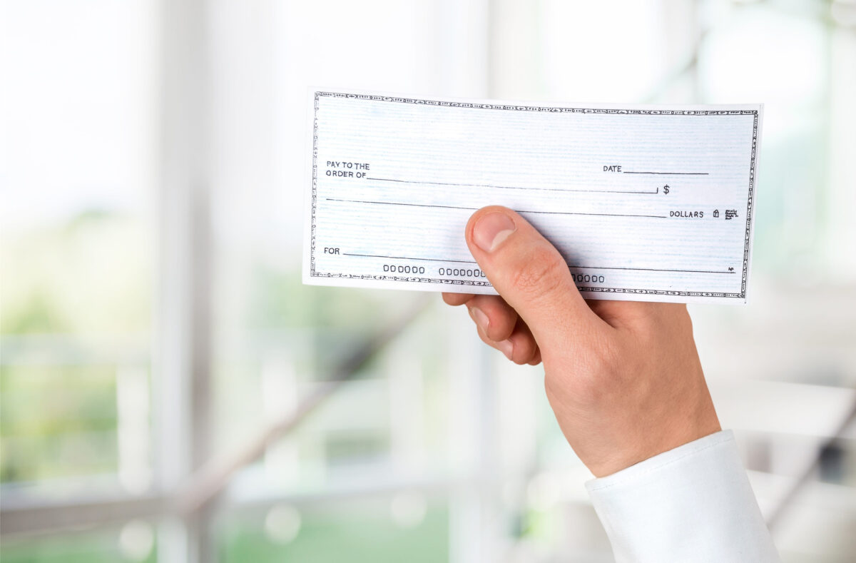 Jeff Bezos Says a Nurse Making $75K Should Not Be Sending $1,000 a Month in Taxes to Washington 1 Blank check in hand