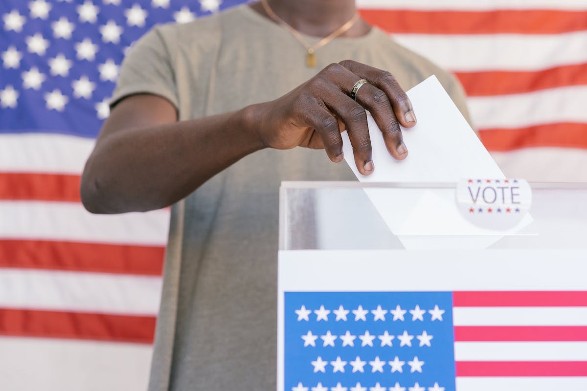House sends landmark housing bill to Trump as America’s affordability crisis enters a new phase. 2 A person casting their vote at a polling station with a US flag in the background.