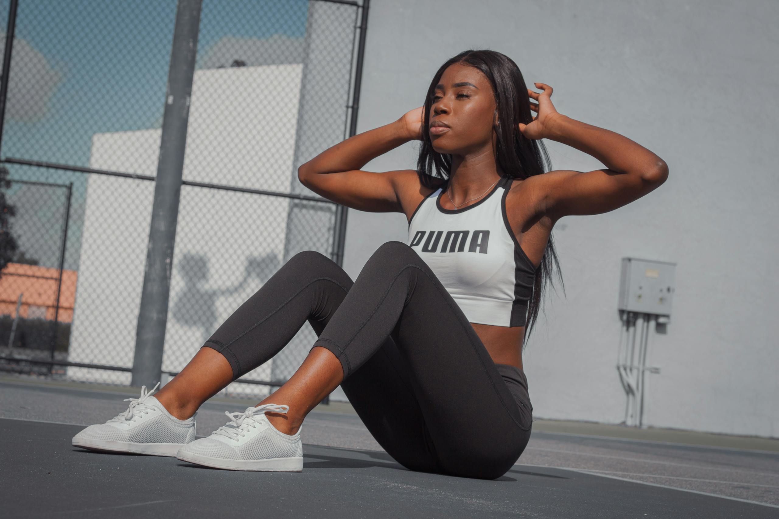 Athletic woman in sportswear exercising outdoors on a sunny day in Tampa, Florida.