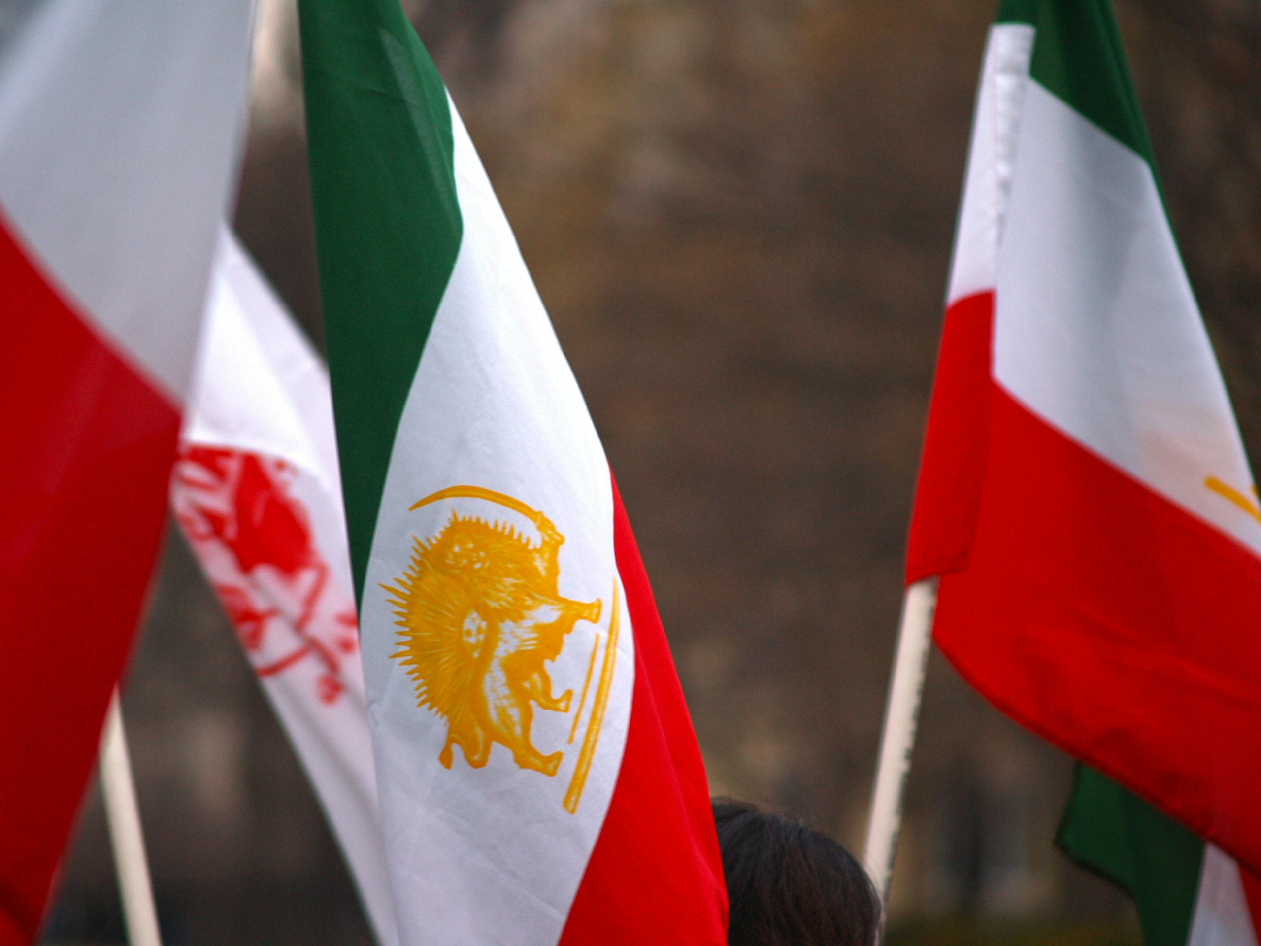 8 Ways Trump’s Chaotic Tough Talk Became Jimmy Kimmel’s Easiest Punchline 2 Close-up of Iranian flags waving outdoors in Washington, DC, showcasing cultural identity.