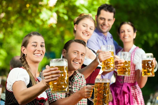 depositphotos 69087243 stock photo in beer garden friends