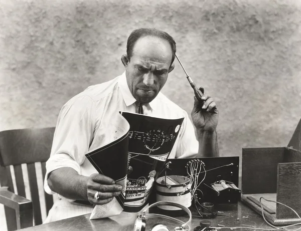 depositphotos 82898812 stock photo man reading instructions
