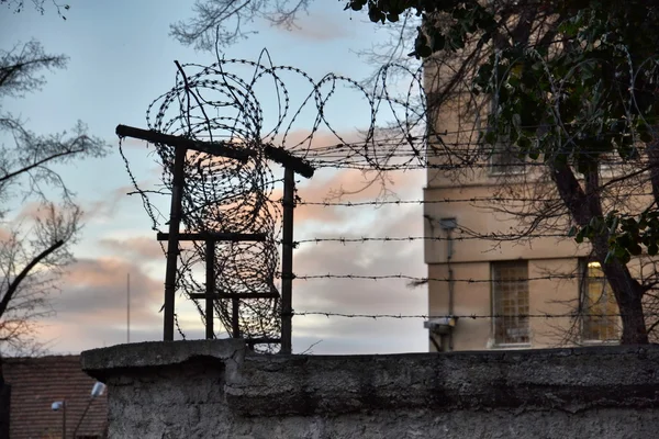 depositphotos 94300072 stock photo barbed wire fence attached around