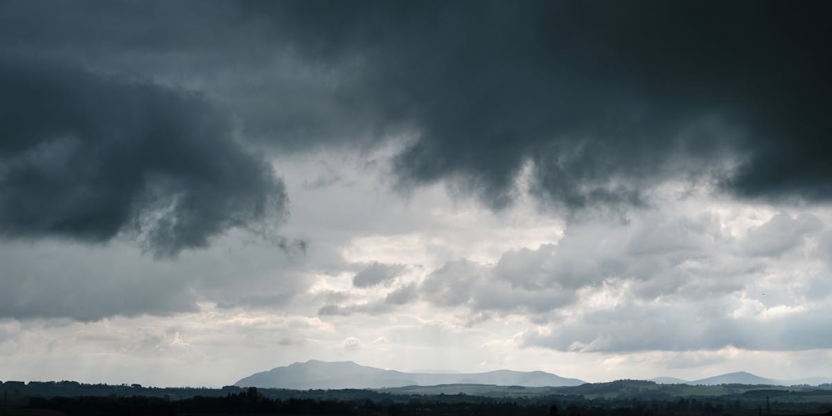 Dramatic sky with clouds over Penrith landscape, capturing the moody weather.