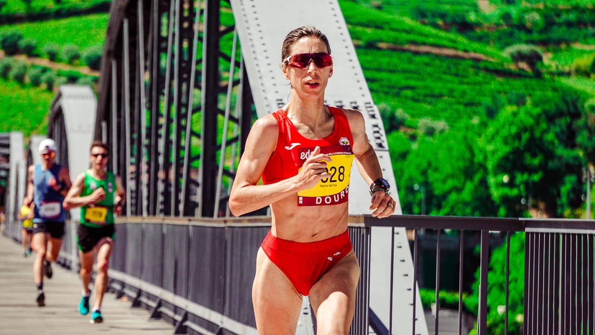 7 Disturbing Thoughts Some Men Admit Having About Revealing Sports Uniforms 1 Focused female athlete competing in a marathon on a scenic bridge. Outdoor sports action.