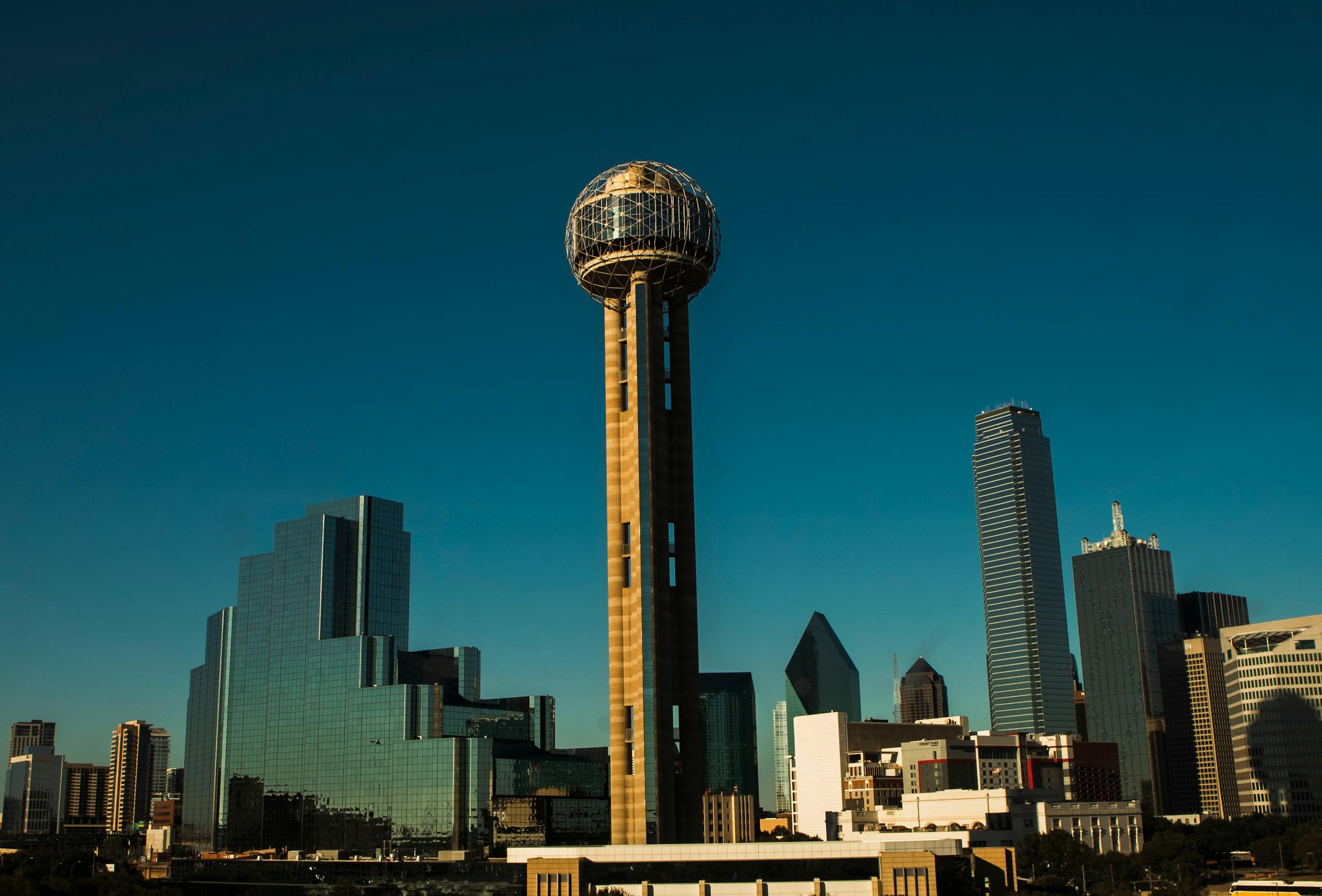10 Republican Run Cities Where the Promise of Order Is Falling Apart 1 Iconic Dallas skyline with Reunion Tower under a clear blue sky.