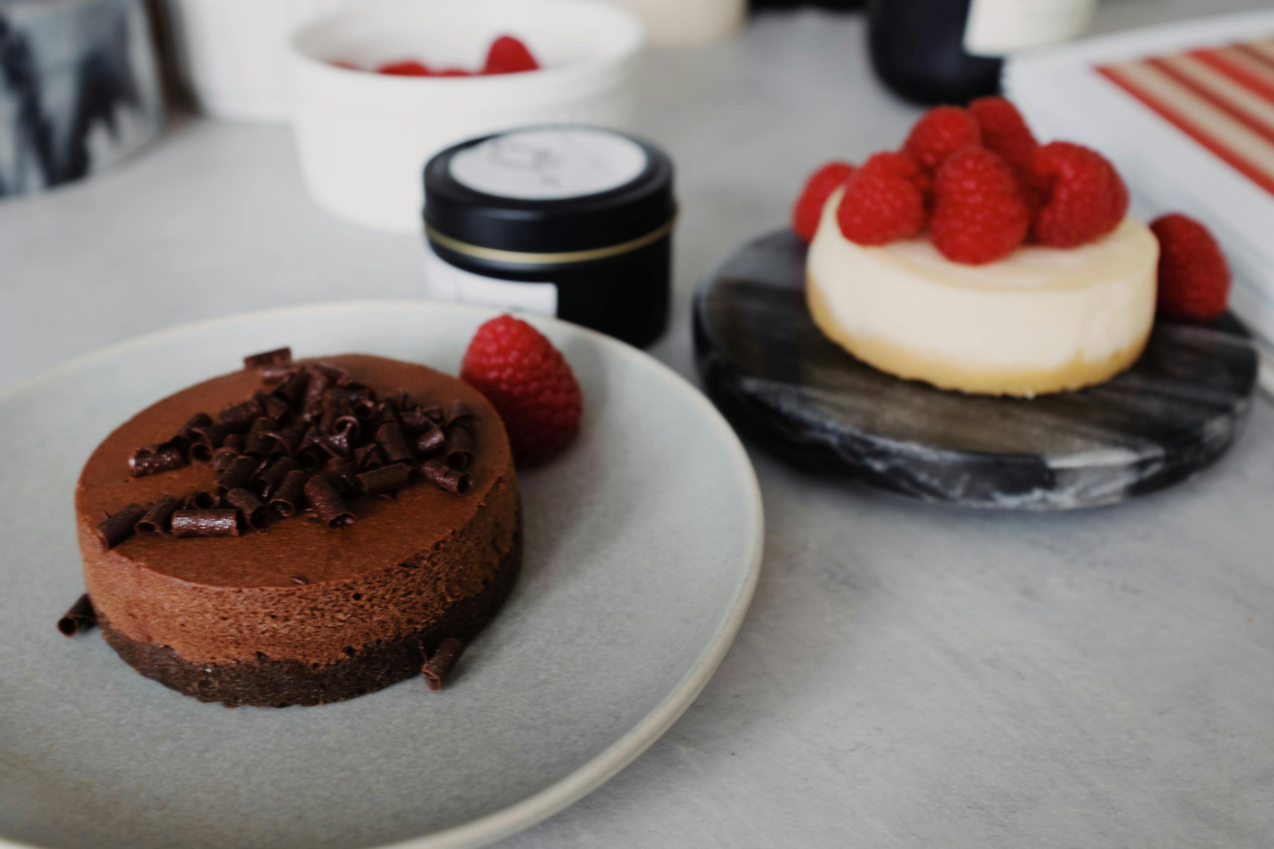 Indulgent chocolate mousse and raspberry cheesecake desserts with rich flavors.