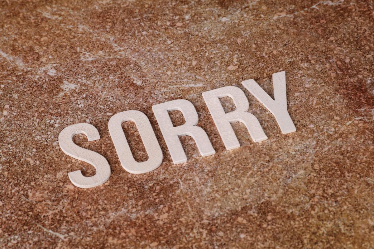 apology-concept-with-sorry-text-on-marble-surface