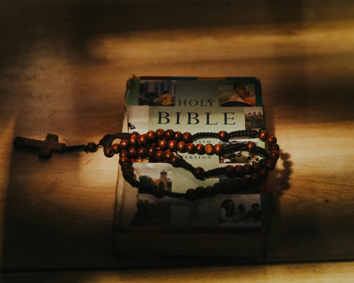 Bible-with-rosary-beads-in-warm-light