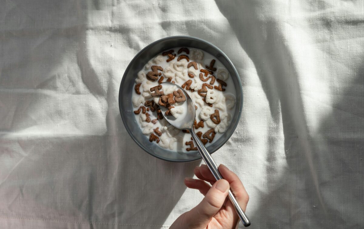 person-holding-stainless-steel-spoon